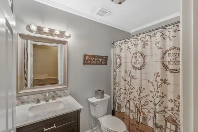 a spacious bathroom with a sink a mirror and a toilet