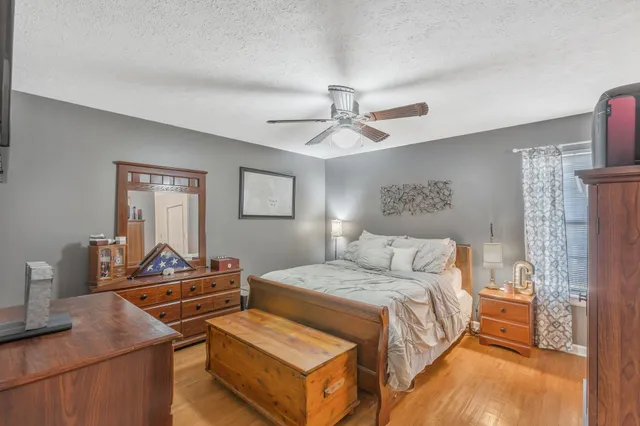 a white toilet sitting next to a shower curtain