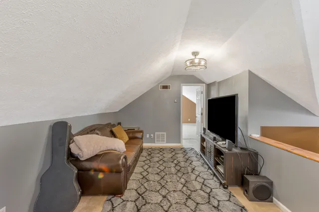 a view of a chairs and table in patio