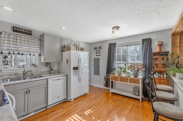 a view of a dining room kitchen and a wooden floor