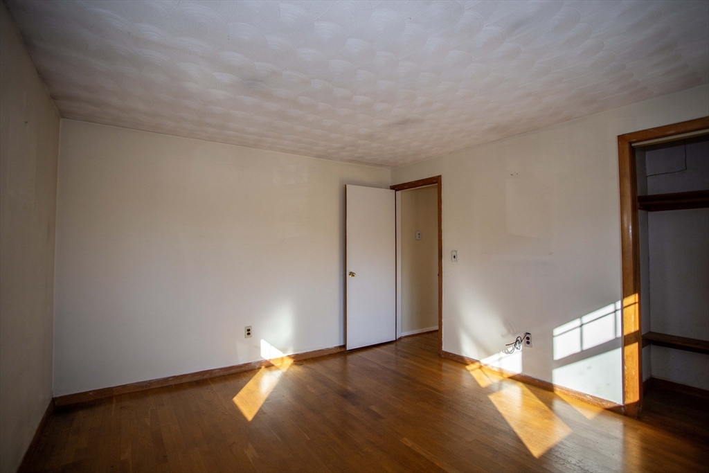 14 Sycamore Road Wakefield, MA 01880 - Photo 19 of 42 a view of an empty room and wooden floor
