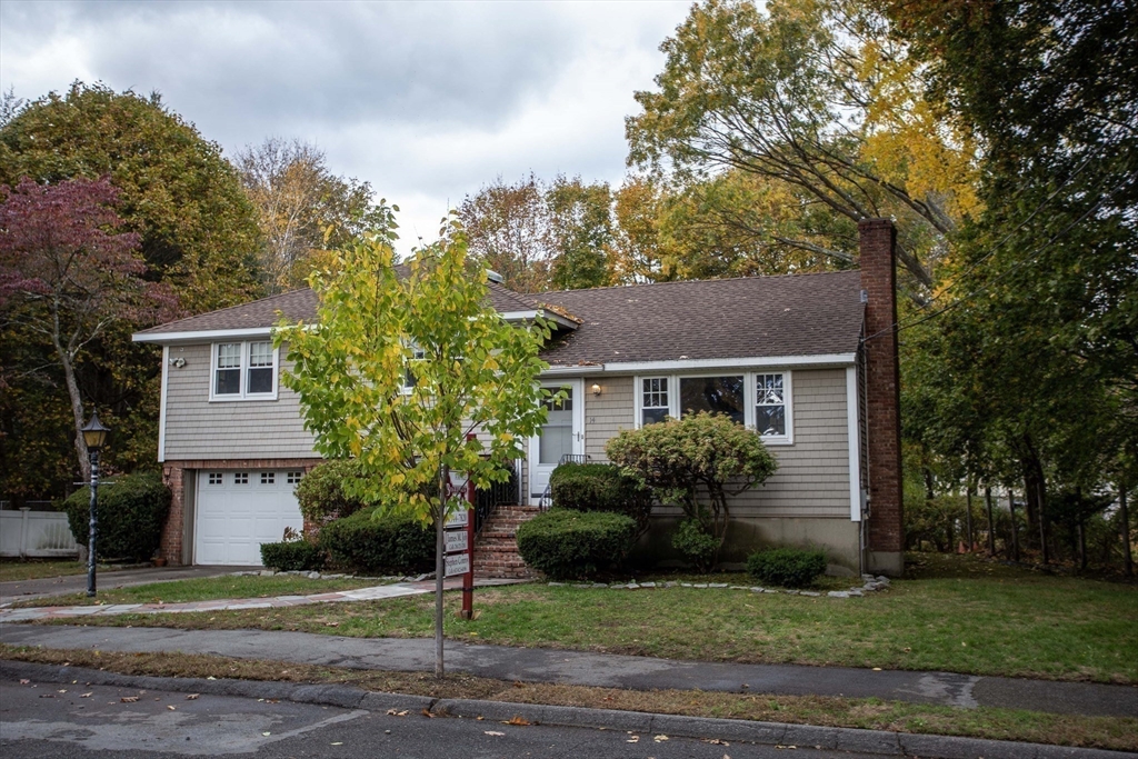 14 Sycamore Road Wakefield, MA 01880 - Photo 32 of 42 a front view of a house with a garden
