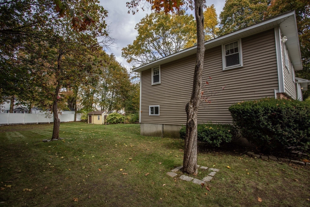 14 Sycamore Road Wakefield, MA 01880 - Photo 36 of 42 a view of backyard of house with green space
