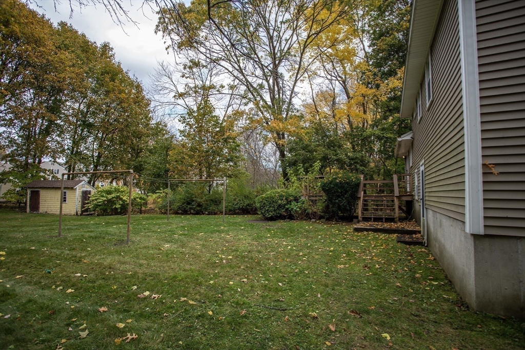 14 Sycamore Road Wakefield, MA 01880 - Photo 42 of 42 a view of a backyard with a garden
