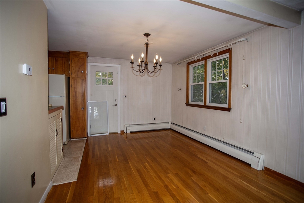 14 Sycamore Road Wakefield, MA 01880 - Photo 8 of 42 a view of a room with wooden floor and chandelier