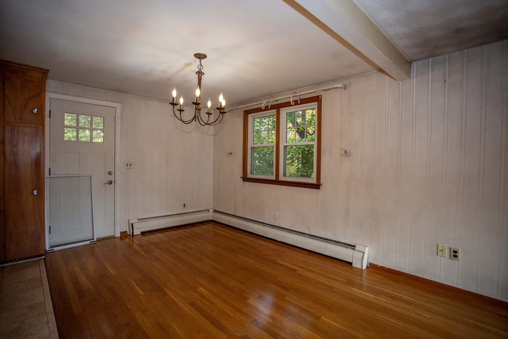 14 Sycamore Road Wakefield, MA 01880 - Photo 9 of 42 wooden floor in an empty room with a window