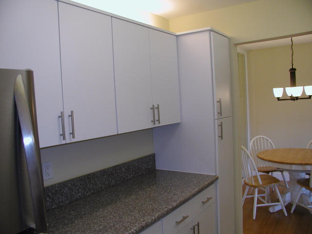762 High Point Boulevard North, Unit D Delray Beach, FL 33445 - Photo 11 of 43 a kitchen with a sink and cabinets