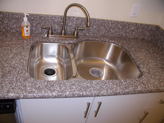 762 High Point Boulevard North, Unit D Delray Beach, FL 33445 - Photo 14 of 43 a close view of sink and tap