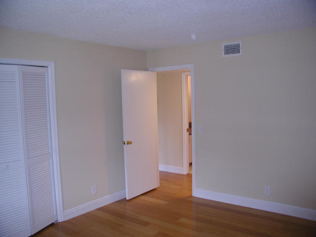 762 High Point Boulevard North, Unit D Delray Beach, FL 33445 - Photo 19 of 43 a view of a room with wooden floor