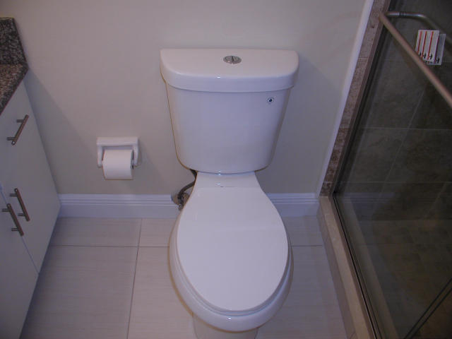 762 High Point Boulevard North, Unit D Delray Beach, FL 33445 - Photo 26 of 43 a bathroom with a toilet and a mirror