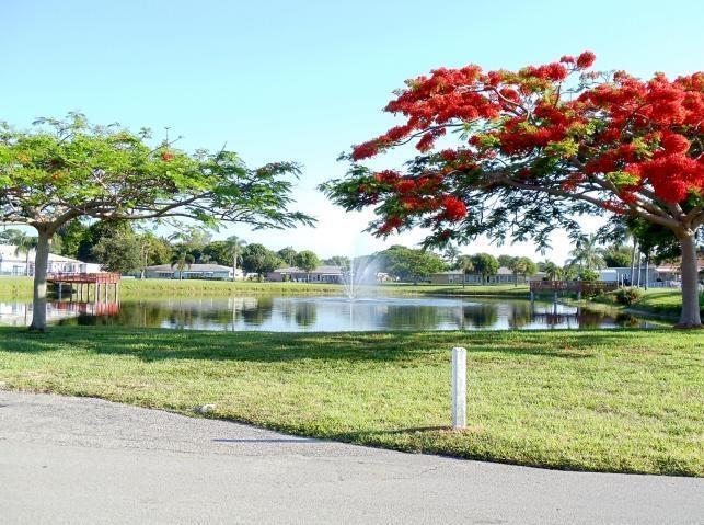 762 High Point Boulevard North, Unit D Delray Beach, FL 33445 - Photo 40 of 43 a view of a lake view