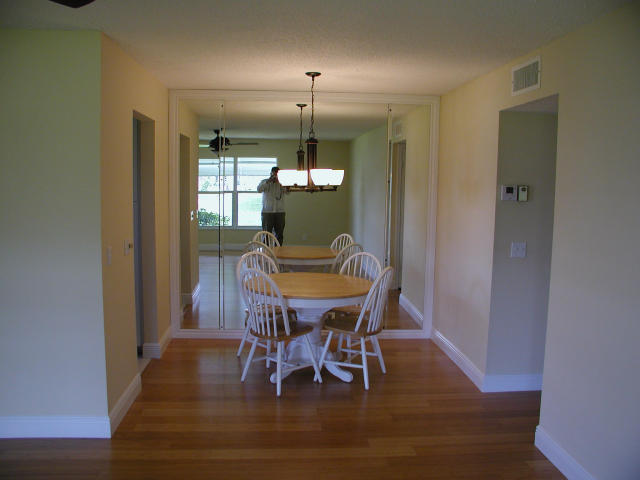762 High Point Boulevard North, Unit D Delray Beach, FL 33445 - Photo 4 of 43 a view of a dining room with furniture window and wooden floor