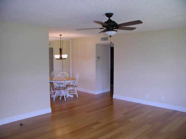 762 High Point Boulevard North, Unit D Delray Beach, FL 33445 - Photo 7 of 43 a view of a livingroom with furniture and wooden floor