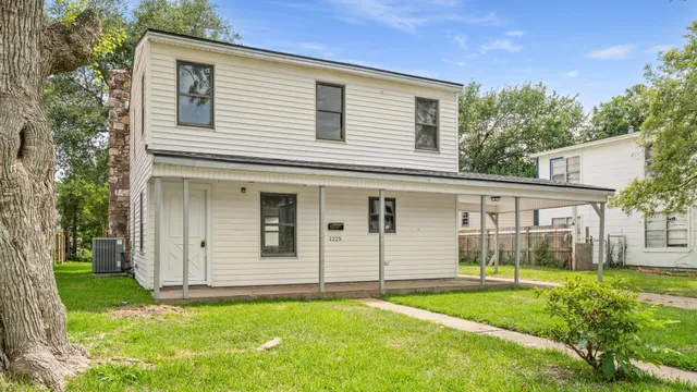 front view of a house with a yard