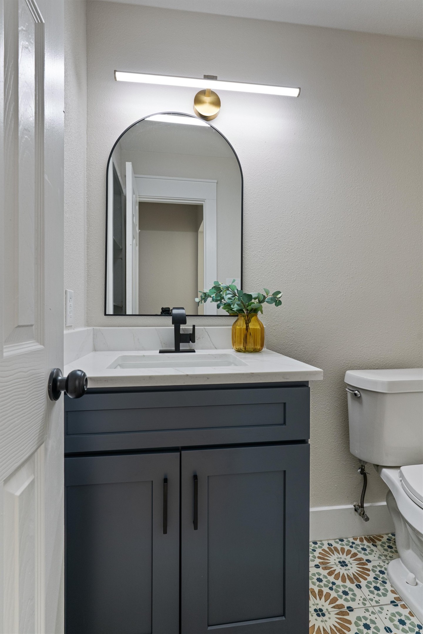 224 Clear Spring Road Georgetown, TX 78628 - Photo 19 of 40 a bathroom with a toilet a sink and mirror
