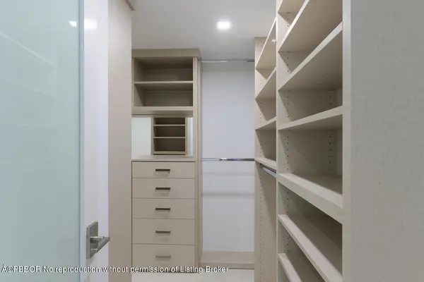 a bathroom with a tub shower and sink