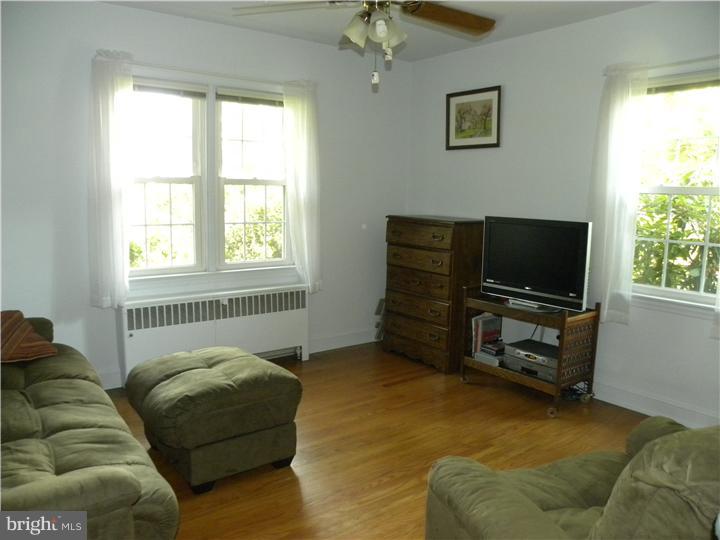 319 Southcroft Road Springfield, PA 19064 - Photo 11 of 24 a living room with furniture and a flat screen tv