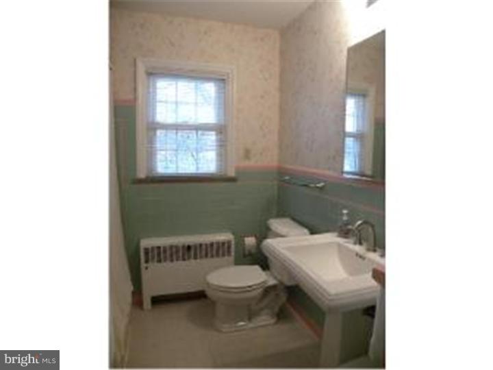319 Southcroft Road Springfield, PA 19064 - Photo 12 of 24 a bathroom with a toilet a sink and a window