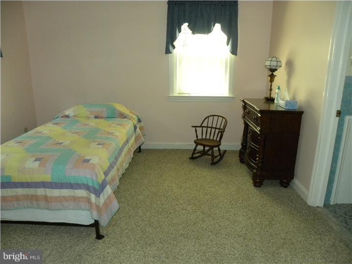 319 Southcroft Road Springfield, PA 19064 - Photo 13 of 24 a bedroom with a bed and a window