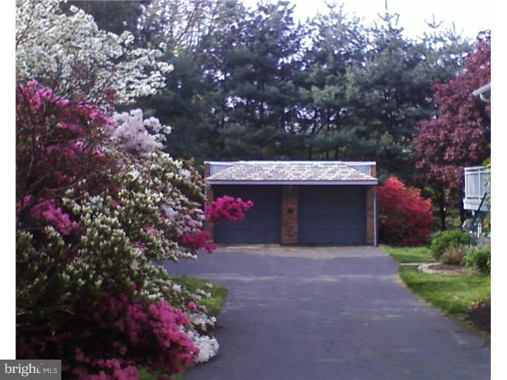 319 Southcroft Road Springfield, PA 19064 - Photo 19 of 24 a front view of a house with a yard and garage