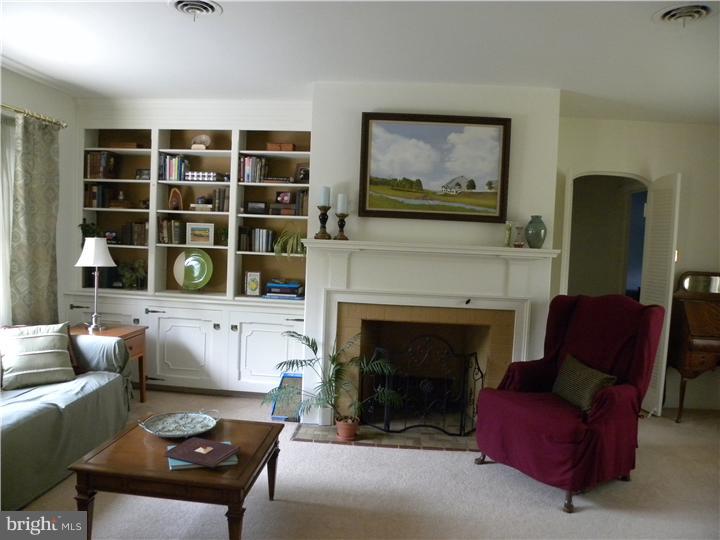 319 Southcroft Road Springfield, PA 19064 - Photo 3 of 24 a living room with furniture and a fireplace