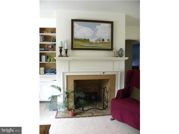 319 Southcroft Road Springfield, PA 19064 - Photo 5 of 24 a living room with furniture and a fireplace
