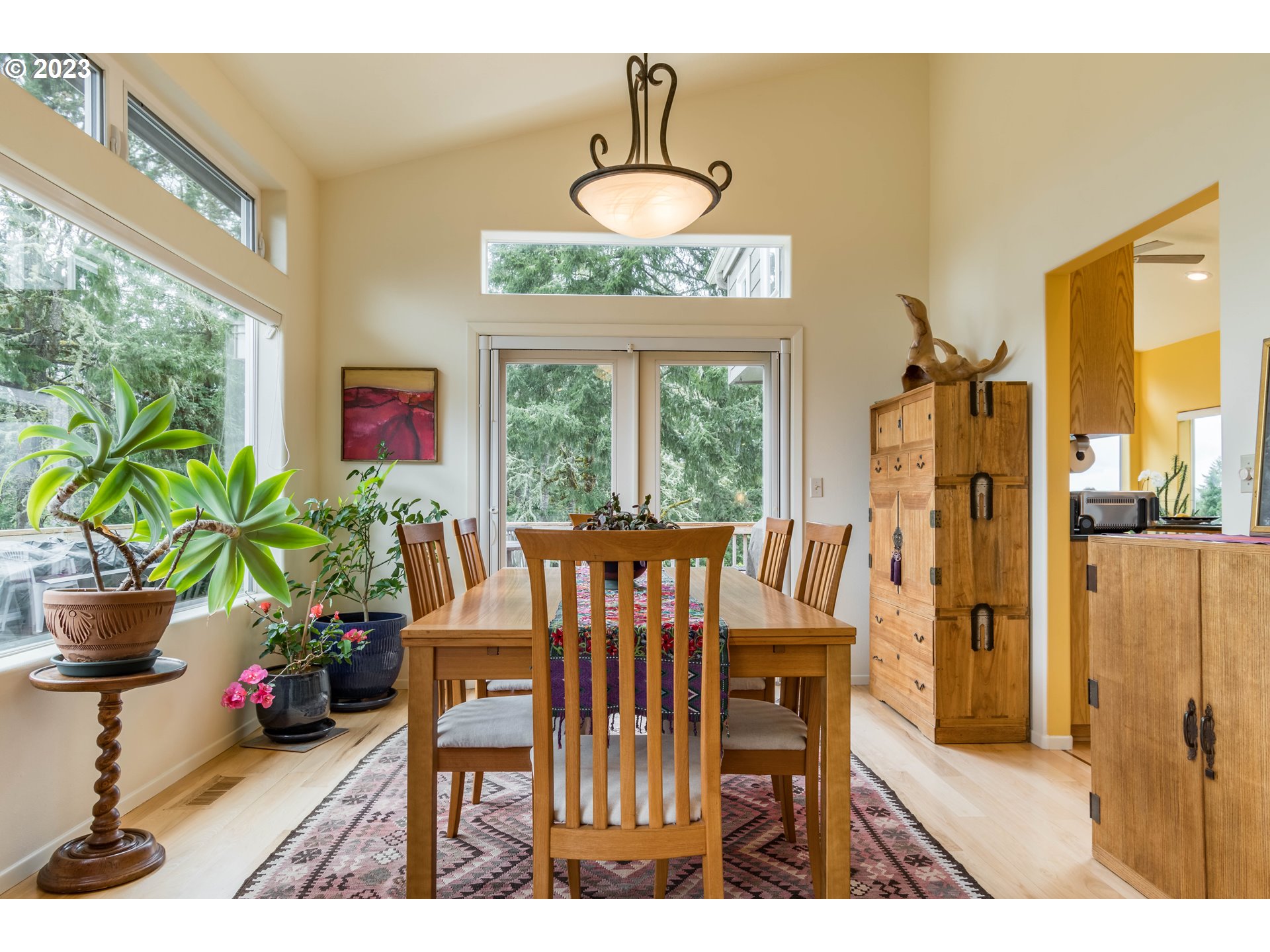 84984 Appletree Drive Eugene, OR 97405 - Photo 11 of 48 a view of a dining room with furniture window and outside view