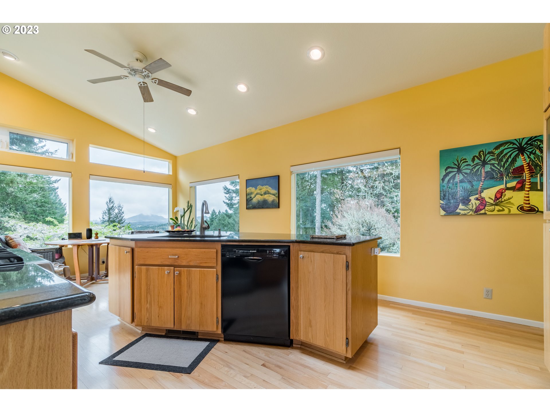 84984 Appletree Drive Eugene, OR 97405 - Photo 14 of 48 a living room with stainless steel appliances granite countertop a refrigerator a sink a stove with wooden floor and cabinets