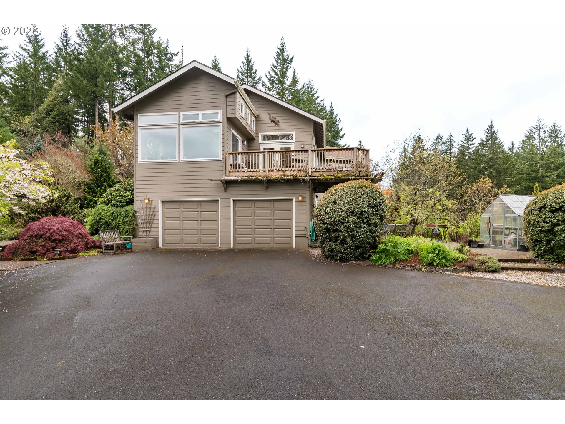 84984 Appletree Drive Eugene, OR 97405 - Photo 2 of 48 a view of a house with a yard and garage