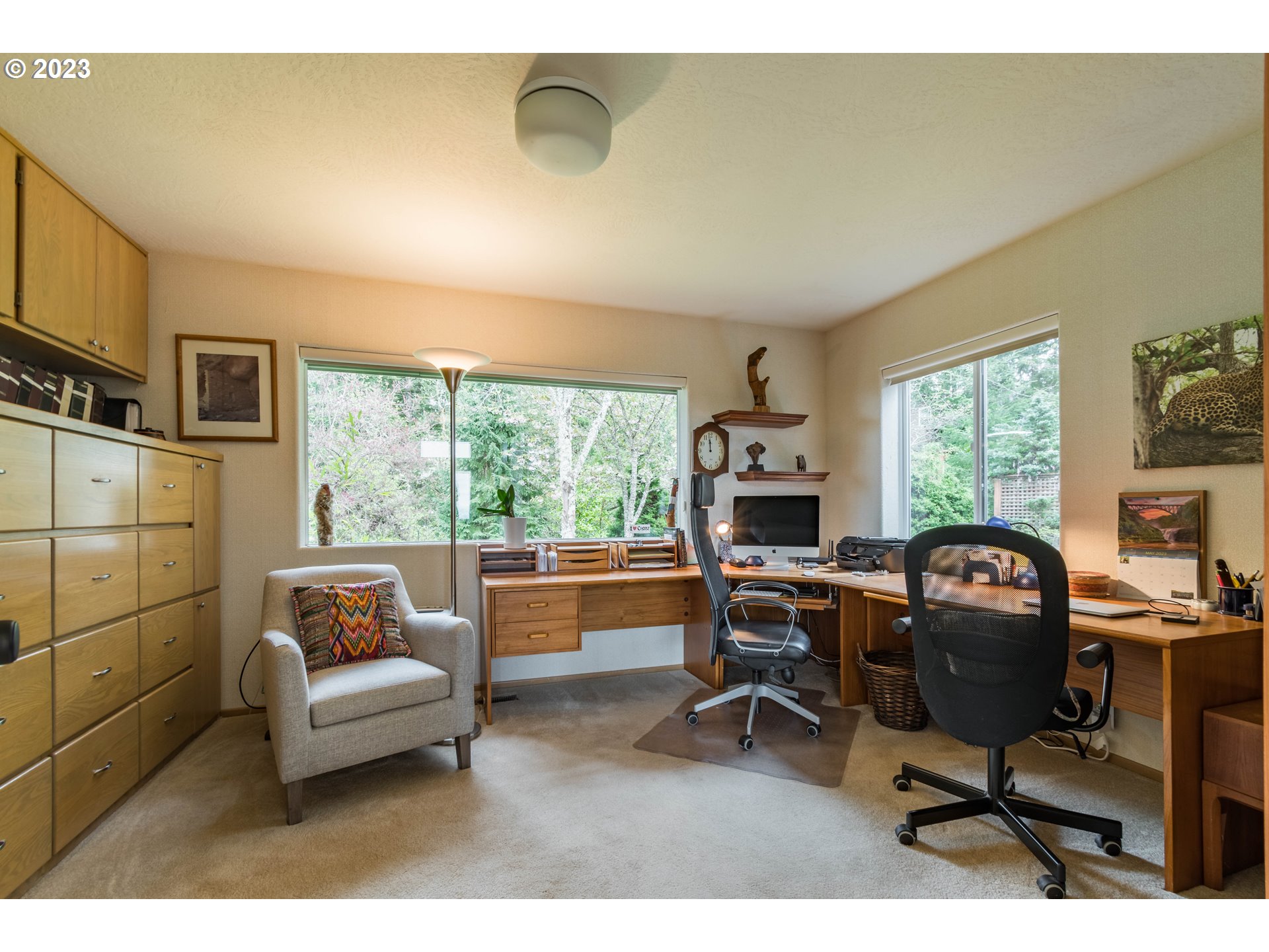 84984 Appletree Drive Eugene, OR 97405 - Photo 24 of 48 a living room with furniture a fireplace and a large window