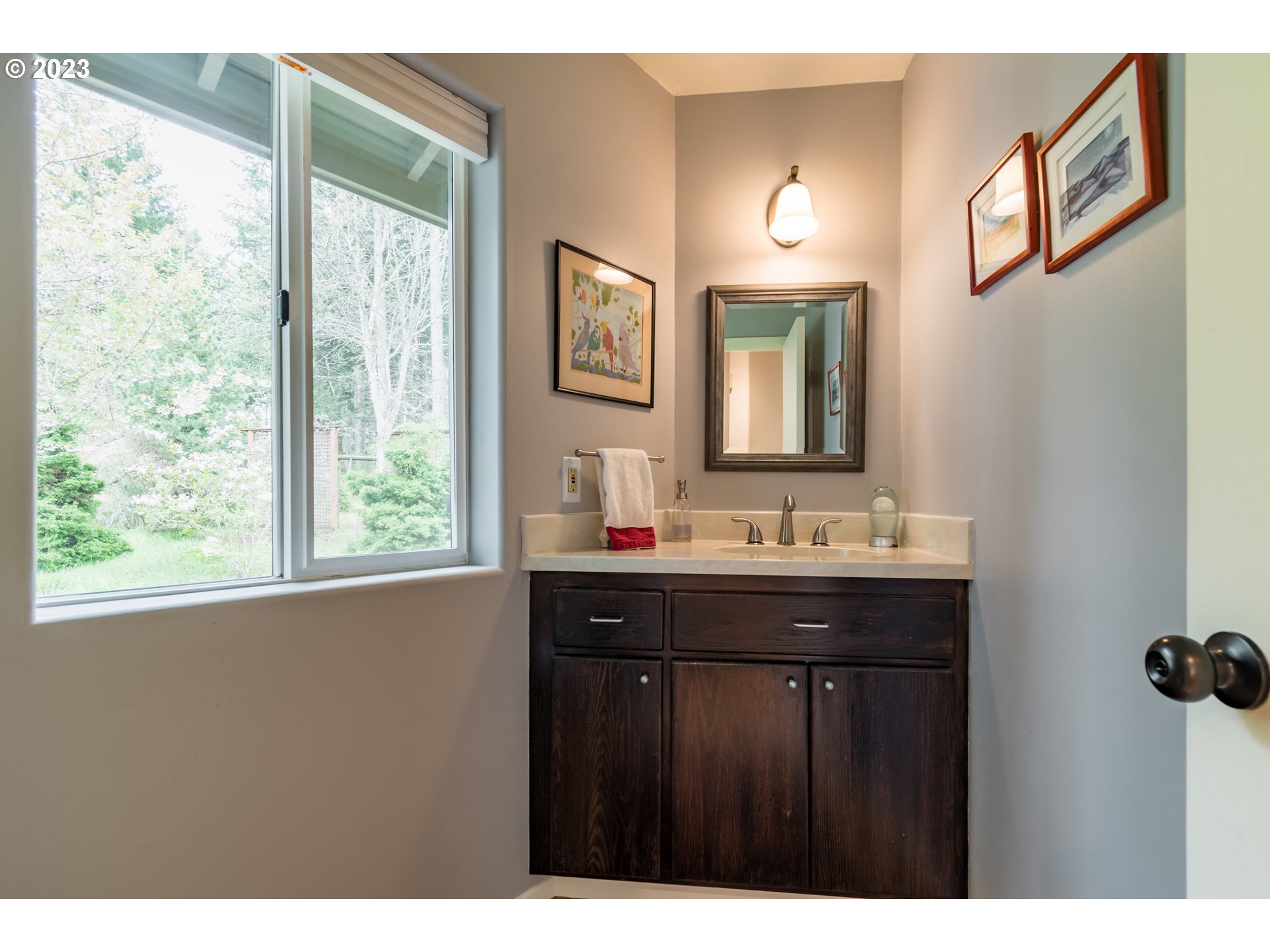84984 Appletree Drive Eugene, OR 97405 - Photo 27 of 48 a bathroom with a sink and a mirror
