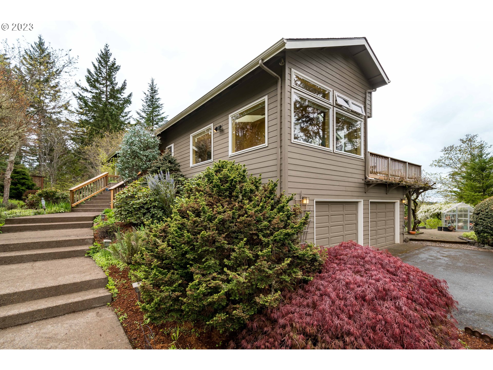 84984 Appletree Drive Eugene, OR 97405 - Photo 3 of 48 a front view of a house with a yard