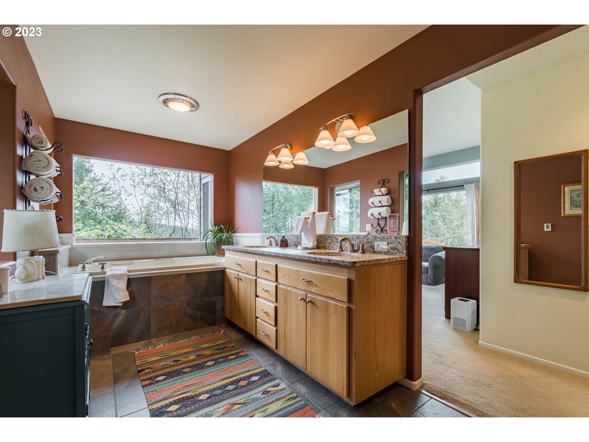 84984 Appletree Drive Eugene, OR 97405 - Photo 32 of 48 a large kitchen with kitchen island granite countertop a stove a sink and a refrigerator