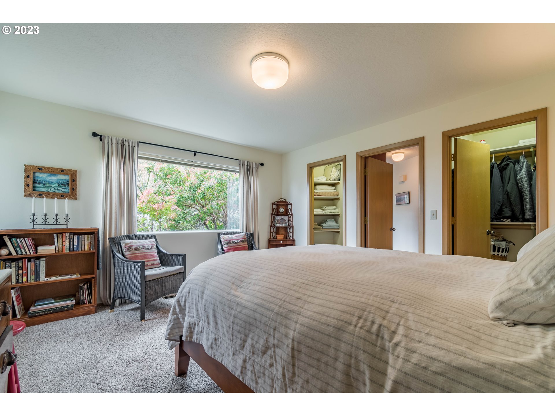 84984 Appletree Drive Eugene, OR 97405 - Photo 43 of 48 a bedroom with a large bed and a large window