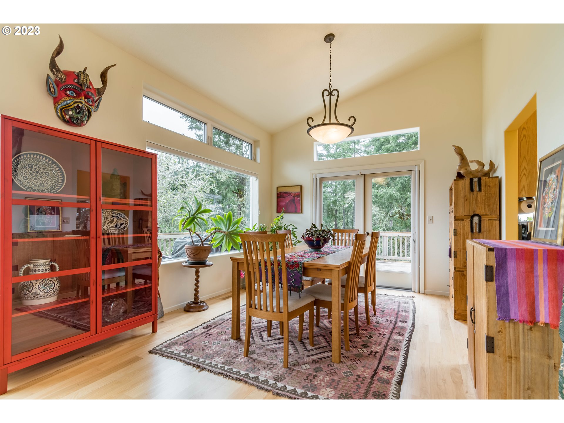 84984 Appletree Drive Eugene, OR 97405 - Photo 10 of 48 a dining room with furniture a rug and a chandelier