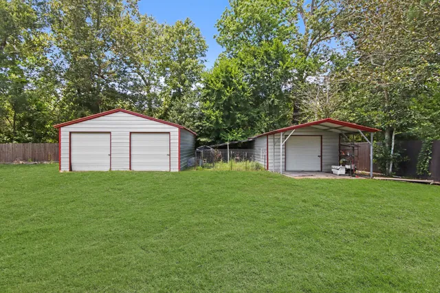 a front view of house with a garden
