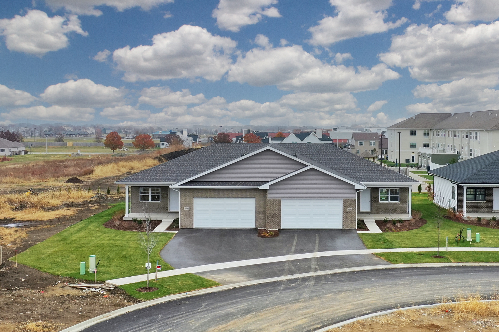 2057 Isabella Lane Minooka, IL 60447 - Photo 2 of 20 a view of a big house with a big yard and large trees