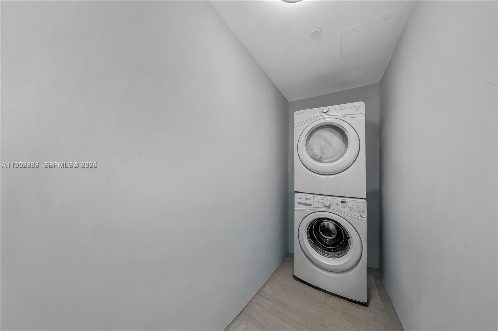 68 Southeast 6th Street, Unit 3309 Miami, FL 33131 - Photo 18 of 25 a utility room with dryer and washer