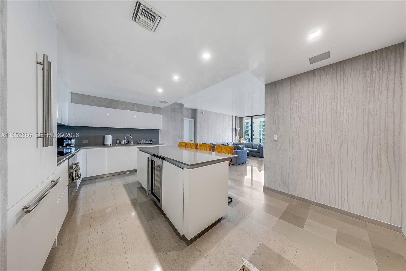68 Southeast 6th Street, Unit 3309 Miami, FL 33131 - Photo 7 of 25 a kitchen with stainless steel appliances a sink and a stove