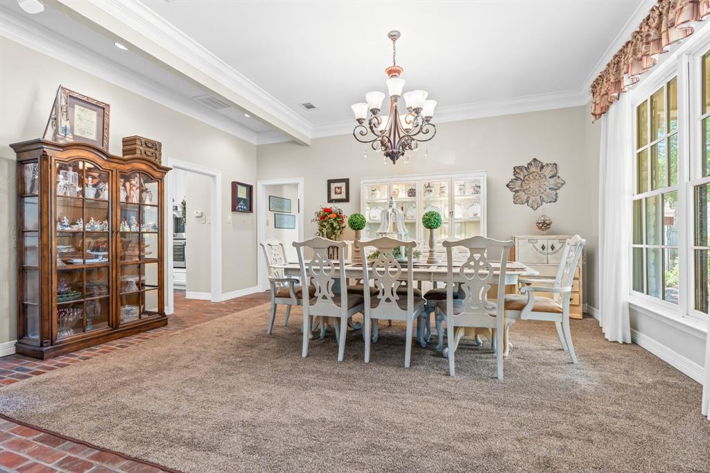 840 Winding Trail Crawford, TX 76638 - Photo 11 of 40 a view of a dining room with furniture and chandelier