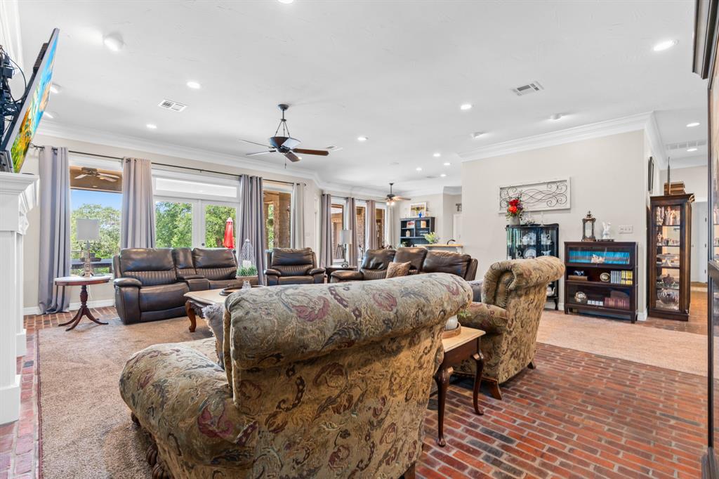 840 Winding Trail Crawford, TX 76638 - Photo 14 of 40 a living room with furniture and a large window