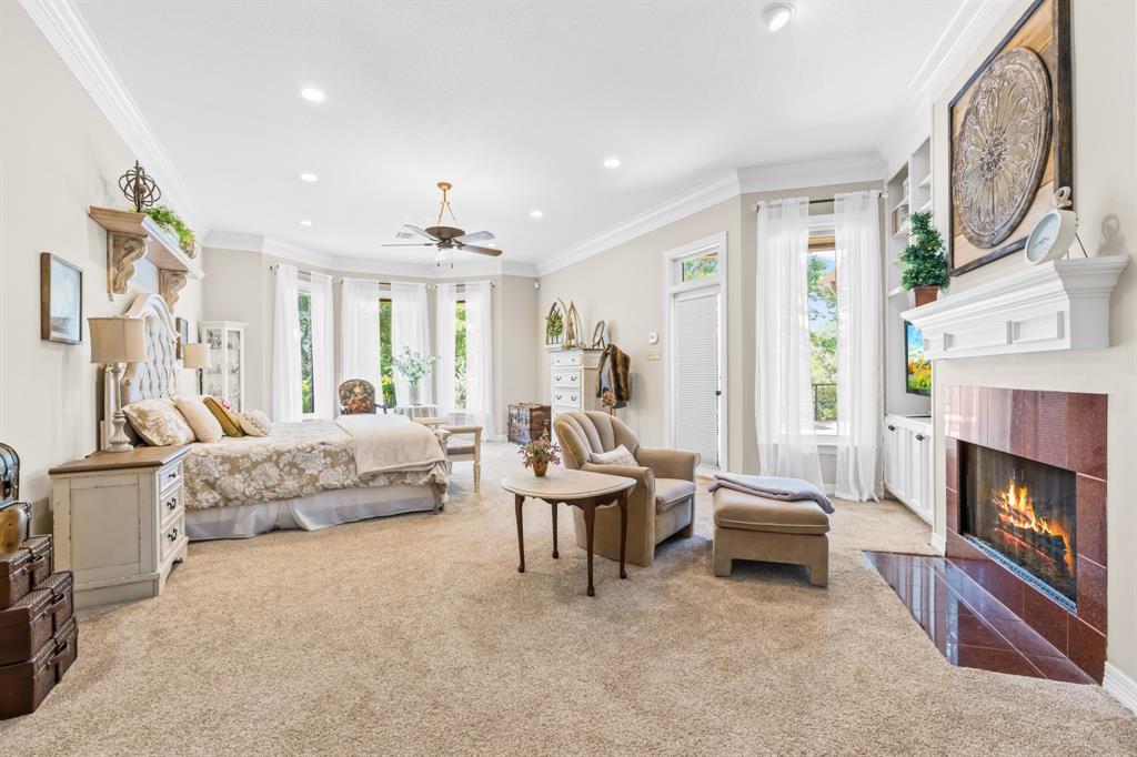 840 Winding Trail Crawford, TX 76638 - Photo 19 of 40 a spacious bedroom with a bed furniture and a fireplace