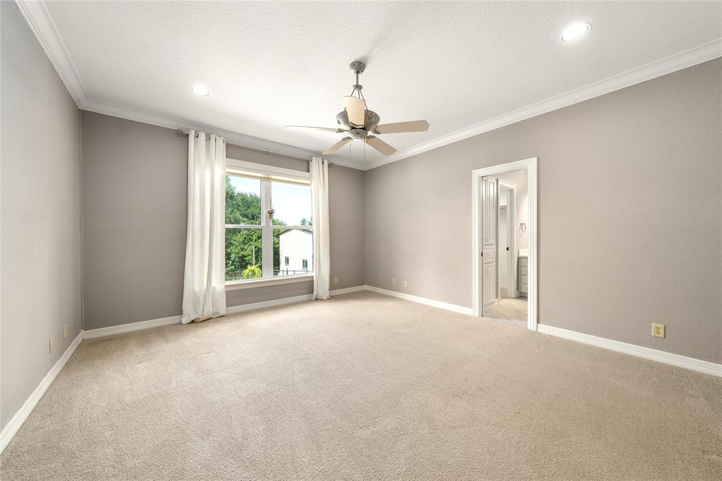 840 Winding Trail Crawford, TX 76638 - Photo 29 of 40 an empty room with windows and ceiling fan