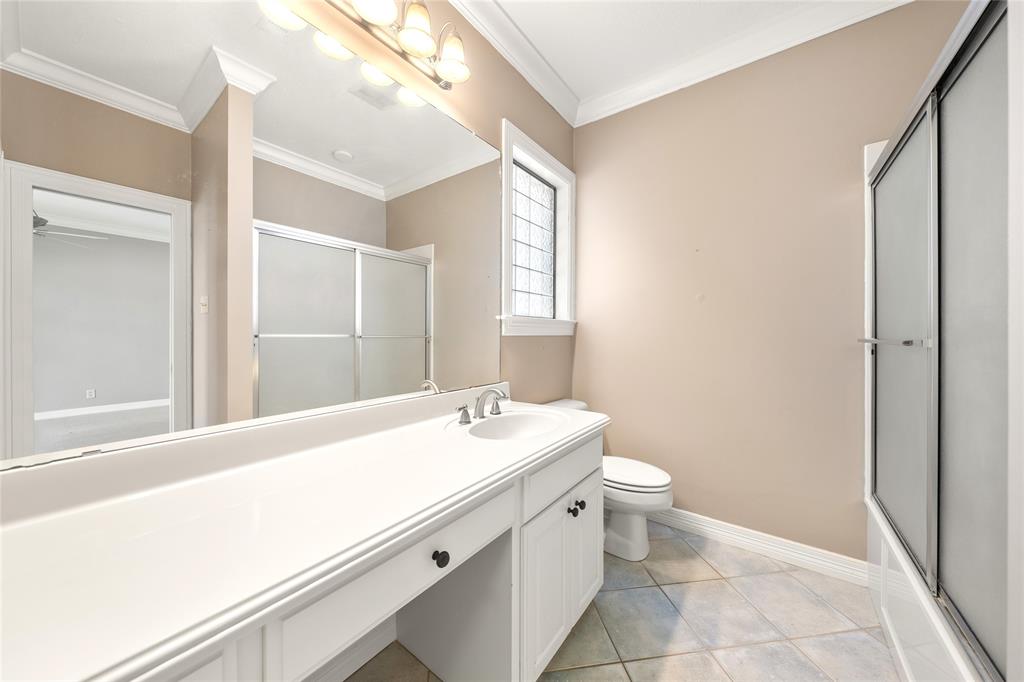 840 Winding Trail Crawford, TX 76638 - Photo 30 of 40 a bathroom with a sink a toilet and a mirror