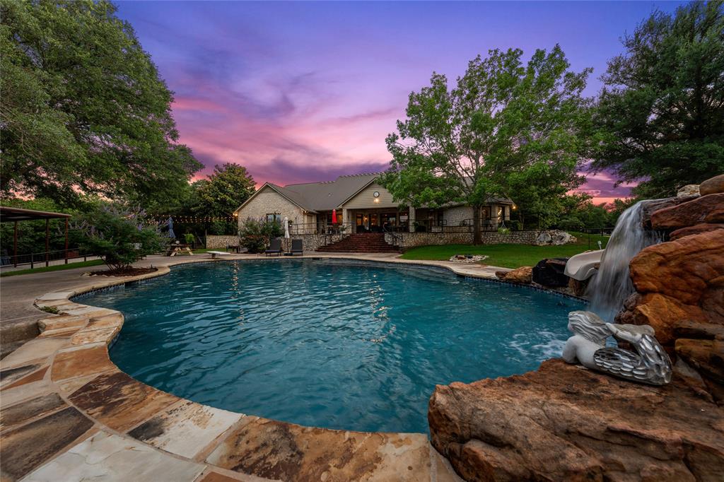 840 Winding Trail Crawford, TX 76638 - Photo 37 of 40 a view of a lake with houses