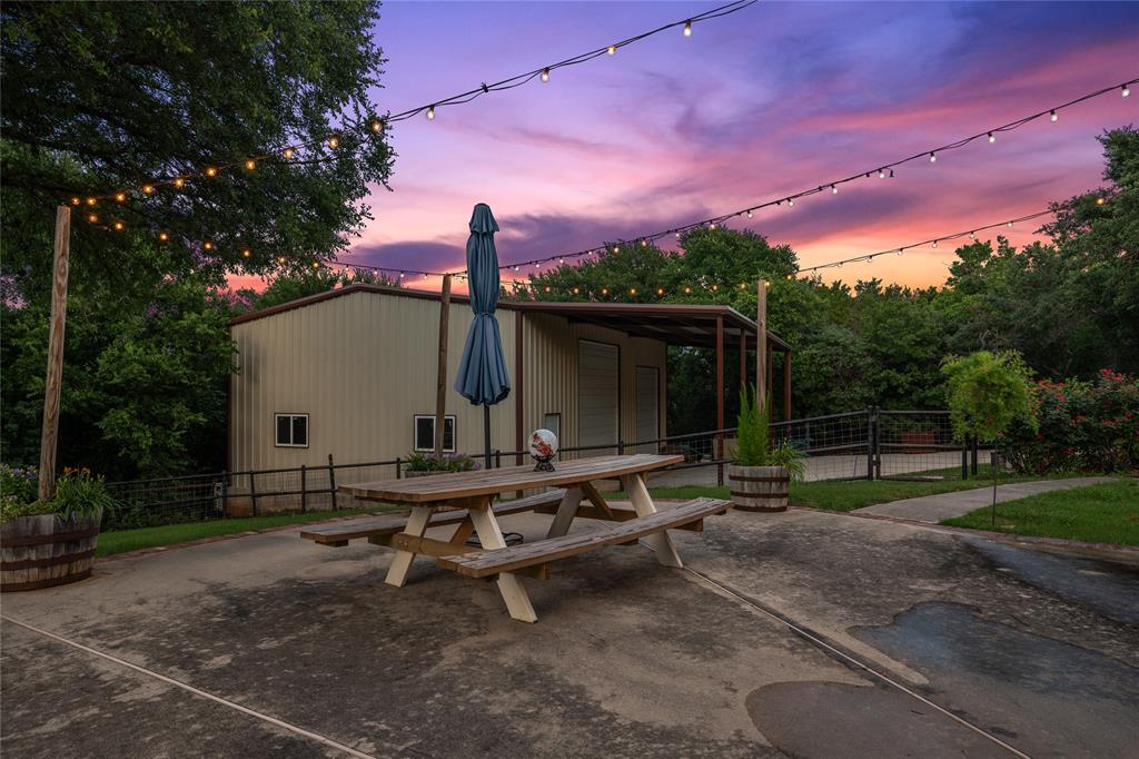 840 Winding Trail Crawford, TX 76638 - Photo 38 of 40 a backyard of a house with table and chairs