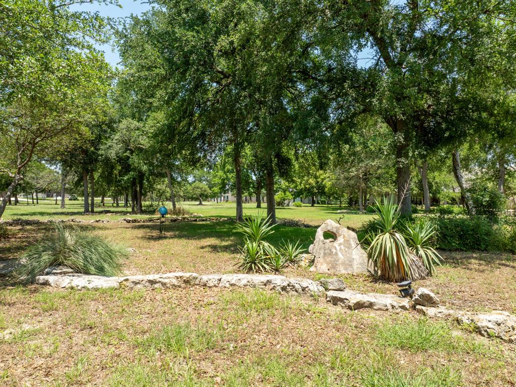 840 Winding Trail Crawford, TX 76638 - Photo 6 of 40 a view of a park with large trees