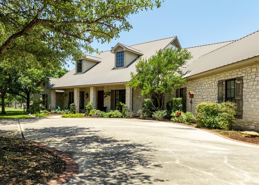 840 Winding Trail Crawford, TX 76638 - Photo 9 of 40 a front view of a house with a yard