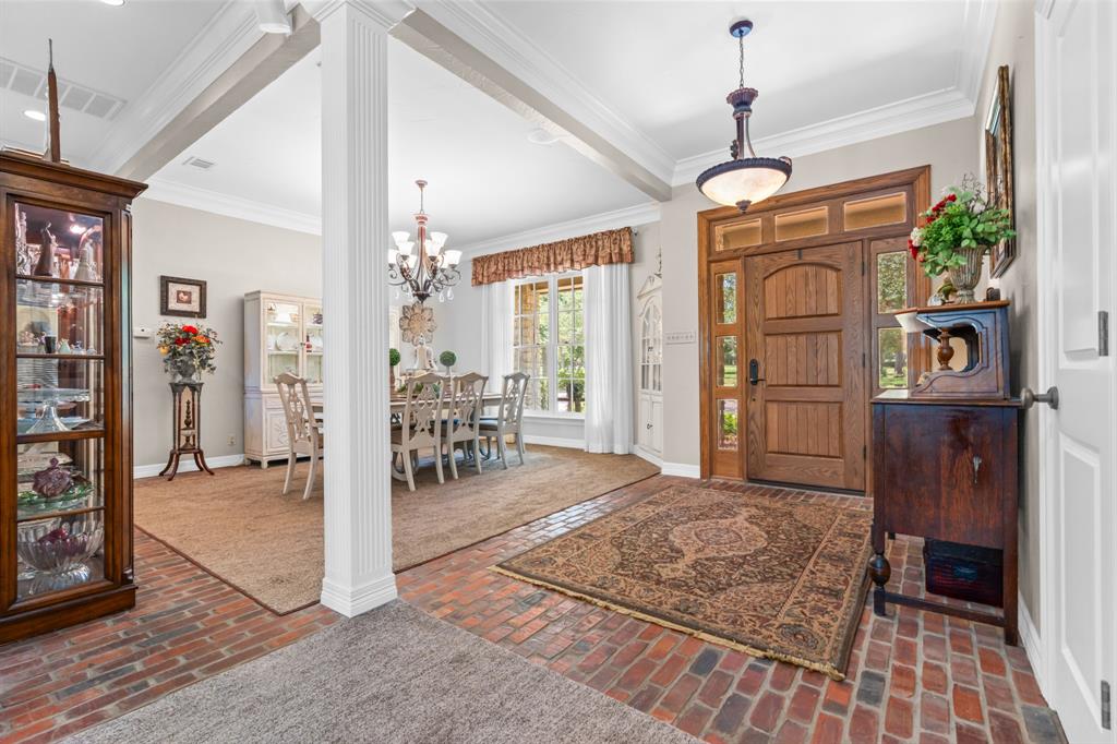840 Winding Trail Crawford, TX 76638 - Photo 10 of 40 a living room with furniture and a chandelier