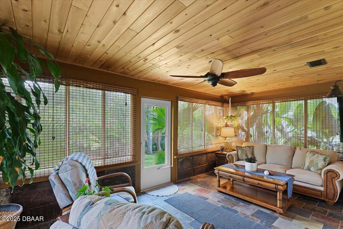 6225 Ranier Circle Port Orange, FL 32127 - Photo 16 of 50 a living room with furniture and a floor to ceiling window